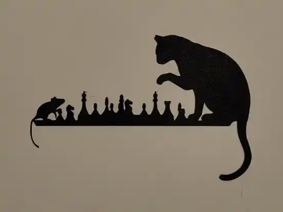 Cat and mouse playing chess