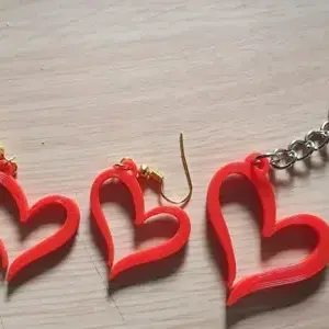 Earrings and keychain in the shape of a heart